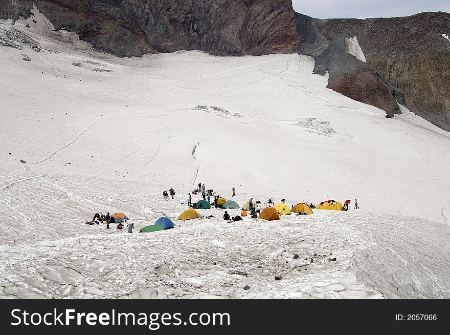 Camp Muir on Mt Rainier with tents pitched. Most are waiting until nightfall to start their trip up to the summit. Camp Muir on Mt Rainier with tents pitched. Most are waiting until nightfall to start their trip up to the summit