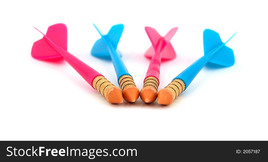 Isolated photo of row of red and blue toy darts, representing the concept of competition.