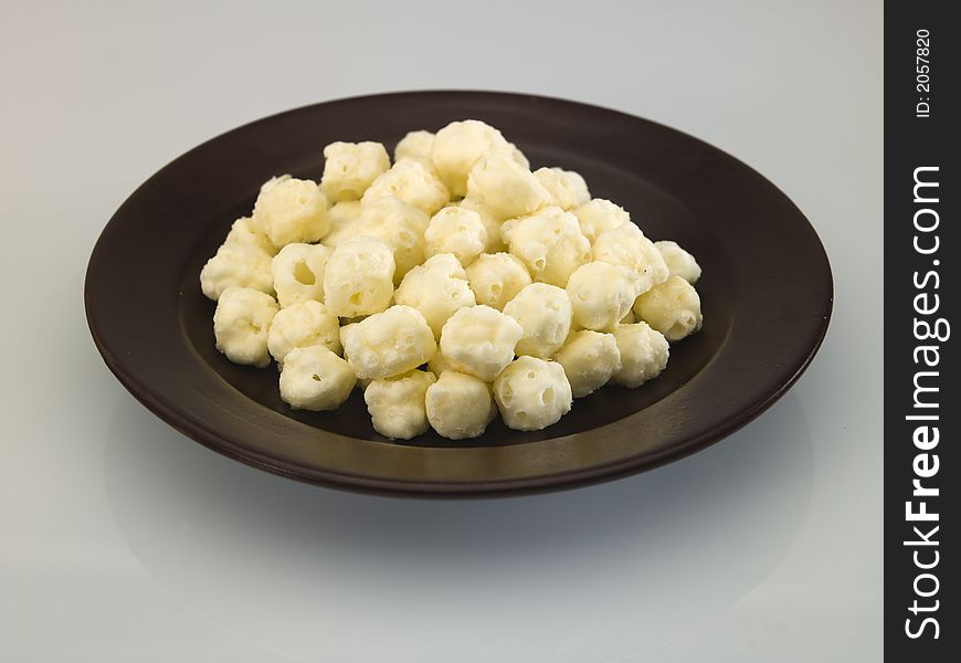 Cheese balls served on ceramic plate. Cheese balls served on ceramic plate