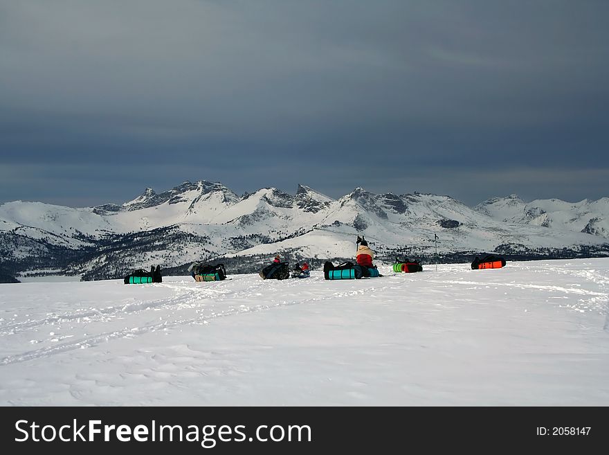 Group of tourists, sitting on crosspass in high mountain. Group of tourists, sitting on crosspass in high mountain