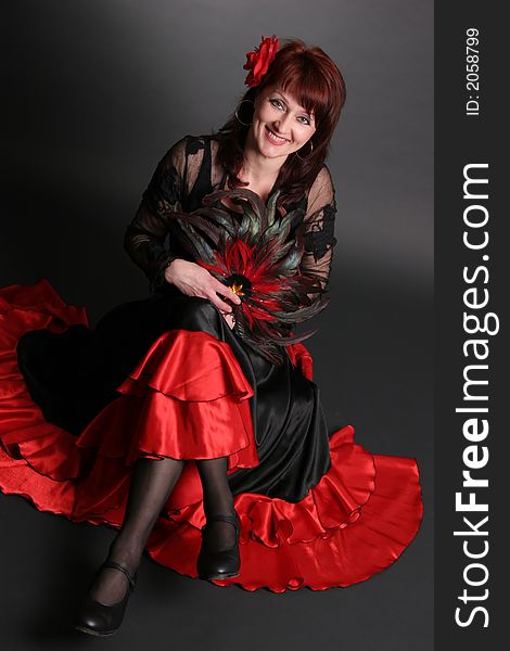 Flamenco dancer on black with rose. Flamenco dancer on black with rose