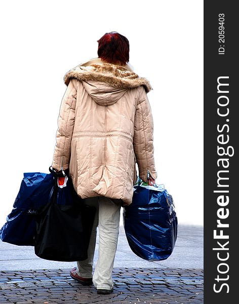 Isolated shopping woman with many things in her hands