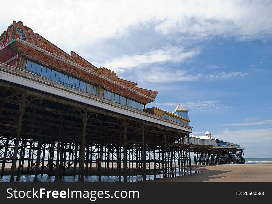 The Victorian Central Pier at Blackpool from the beach looking towards the sea. The Victorian Central Pier at Blackpool from the beach looking towards the sea