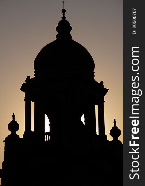 Silhouette of one of the minarets of Victoria Memorial against the setting sun. Silhouette of one of the minarets of Victoria Memorial against the setting sun