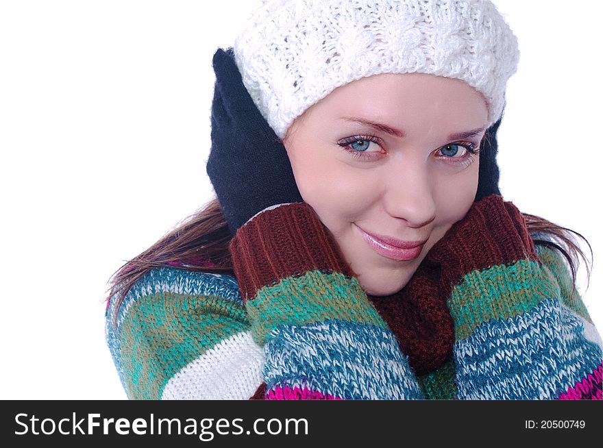 Beautiful girl portrait in winter clothes on white