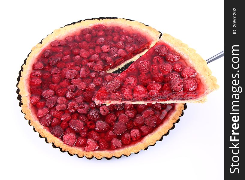 Raspberry Tart in a tart pan, a portion cut out