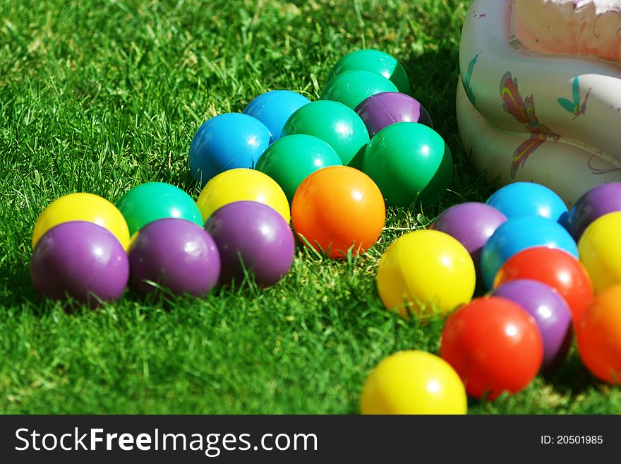 Background, colorful plastic balls on children's playground