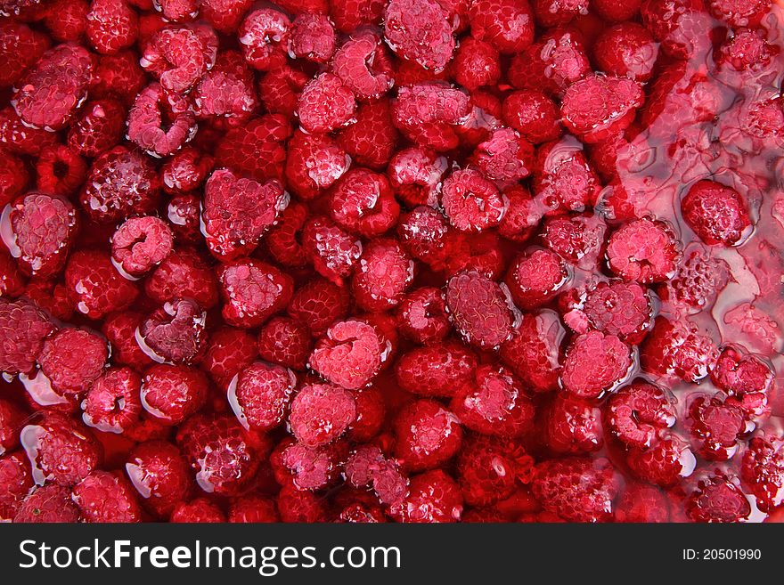 Raspberries in jelly in close up