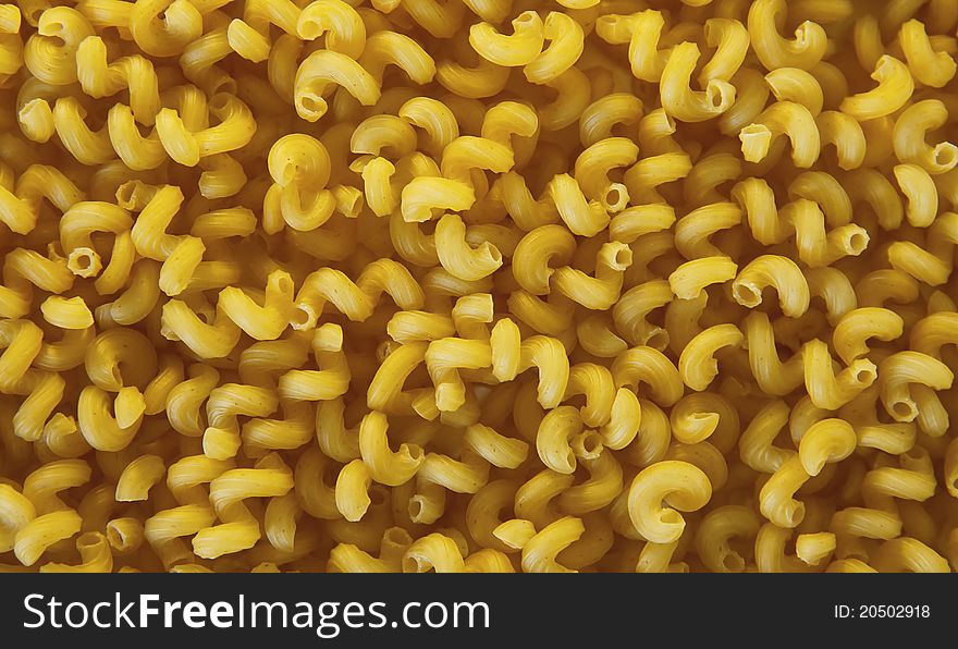 Closeup twisted macaroni (background, texture)