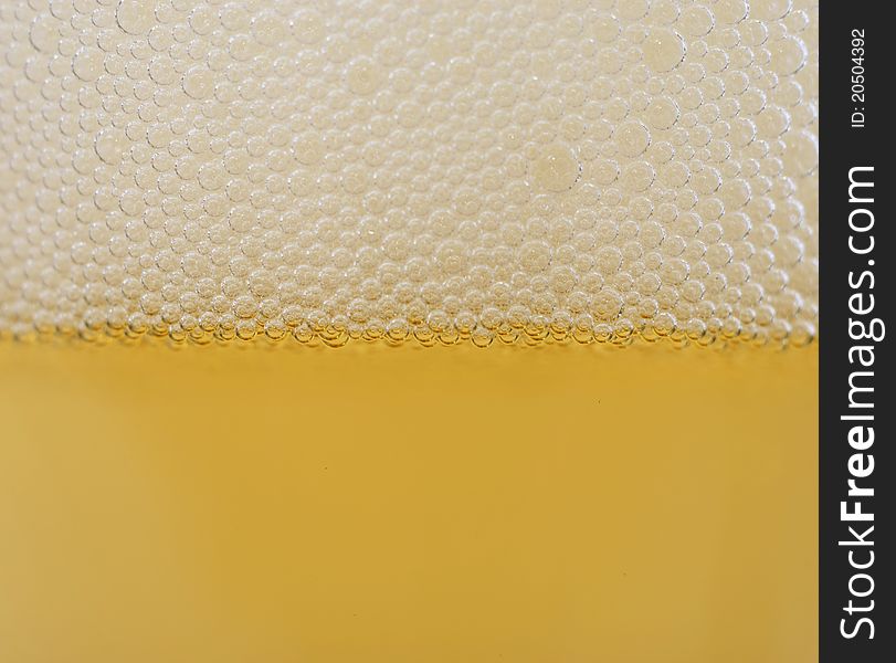 Close up of beer bubbles yellow perfect bubbles