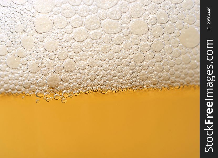 Close up of beer bubbles yellow perfect bubbles