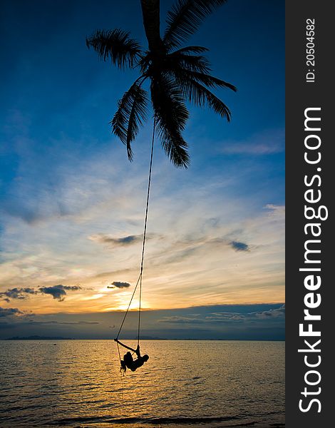 Kid swing with coconut tree