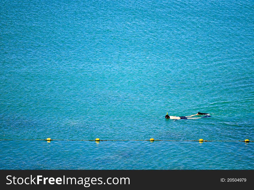 Snorkeling alone in the sea