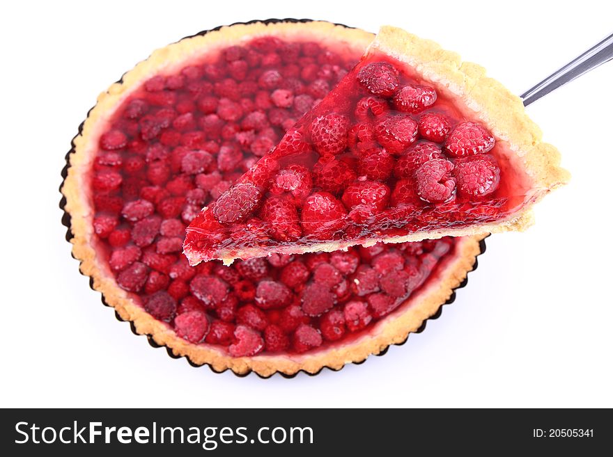 Raspberry Tart in a tart pan, a portion cut out