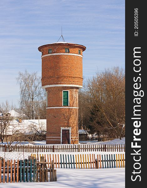 Old water tower in a winter sunny day