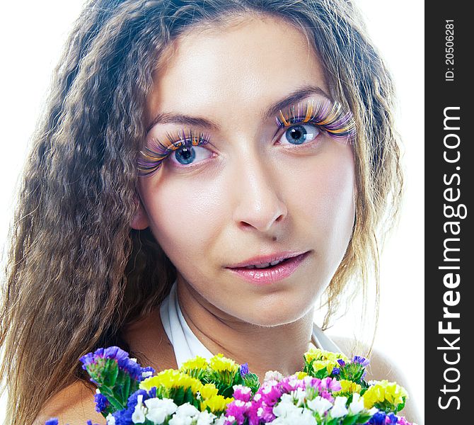 Attractive smiling woman portrait on white background with flowers