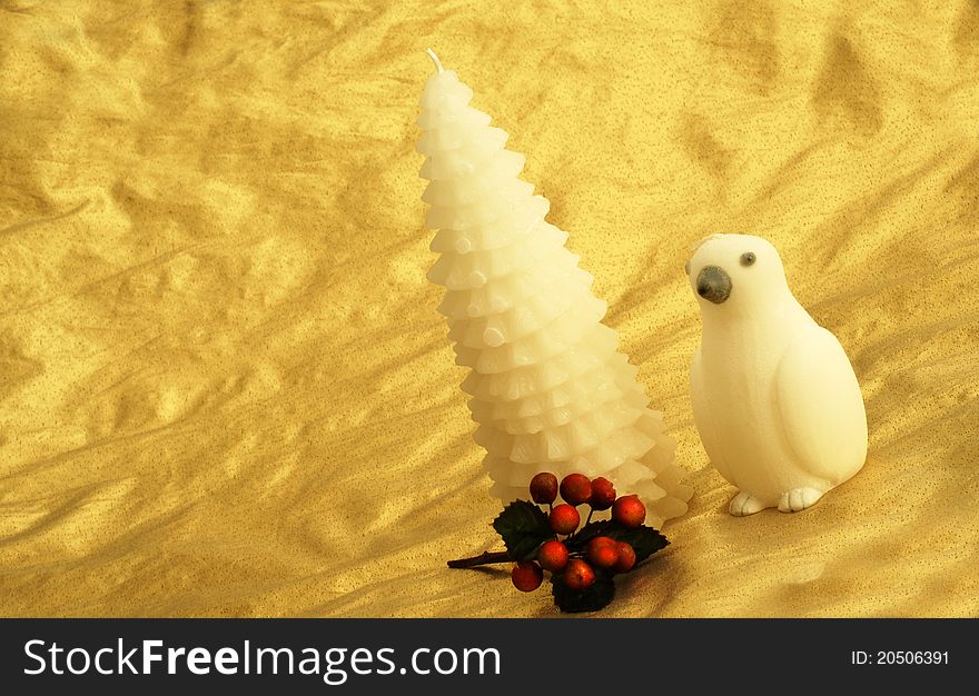 White penguin candle gold background with red accents space holiday christmas. White penguin candle gold background with red accents space holiday christmas