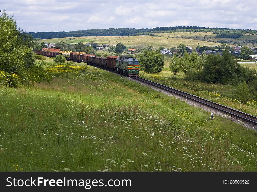 Diesel locomotive with freight cars in prairie