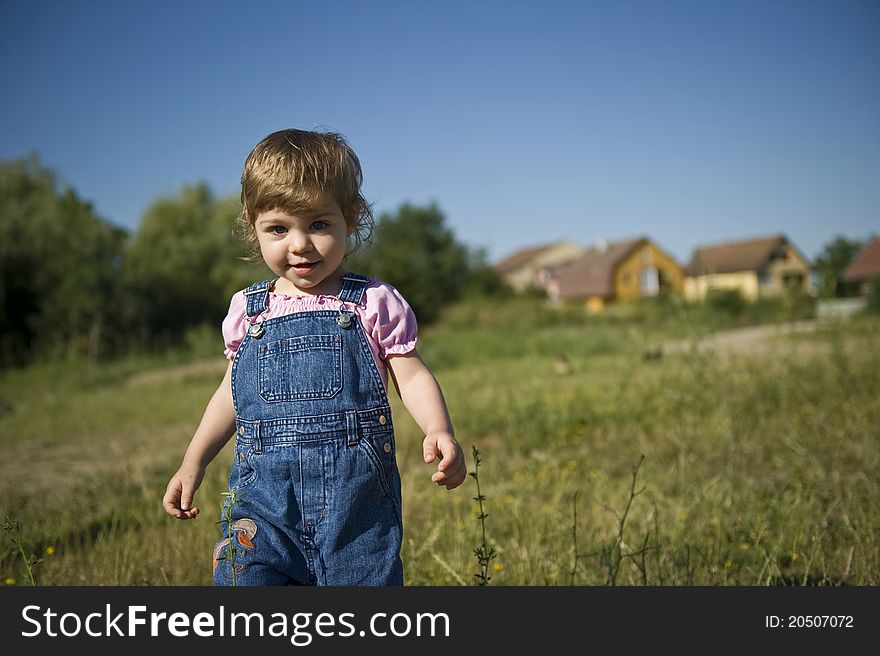 Portrait of smiling little girl with blue eyes, running. Portrait of smiling little girl with blue eyes, running