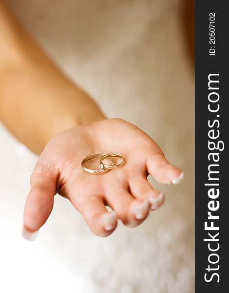 Bride showing two wedding rings on her hand