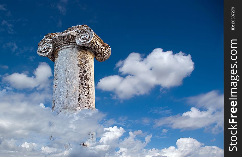 Column of the Roman city Abritus, romantic background sky with clouds. Column of the Roman city Abritus, romantic background sky with clouds