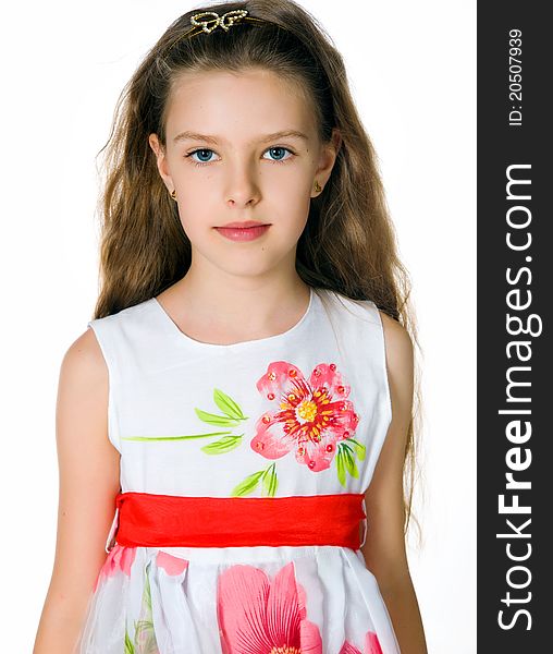 Little girl in red dress on white background