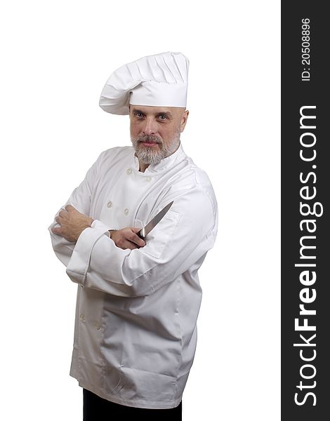 Portrait of a chef with crossed arms and a knife in a chef's hat and uniform isolated on a white background. Portrait of a chef with crossed arms and a knife in a chef's hat and uniform isolated on a white background.