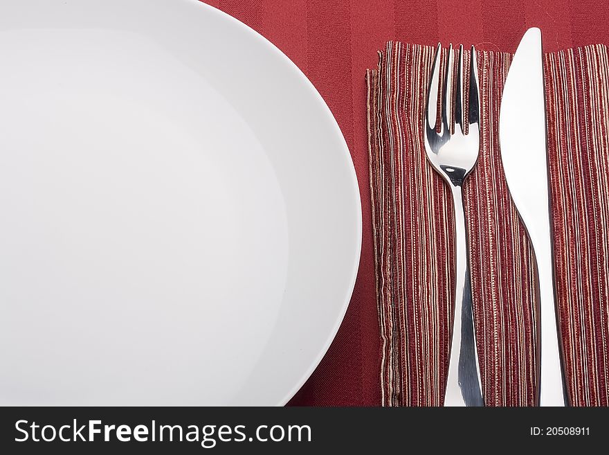 Knife and fork on a napkin as a dining room serving.