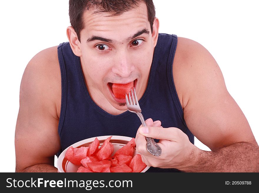 Young Man Eating A Fresh Water Melon.