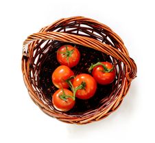 Tomatoes In The Rattan Basket Royalty Free Stock Photography