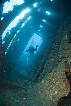 Divers Exploring A Large Shipwreck Stock Image Divers Exploring A Large Shipwreck Stock Image