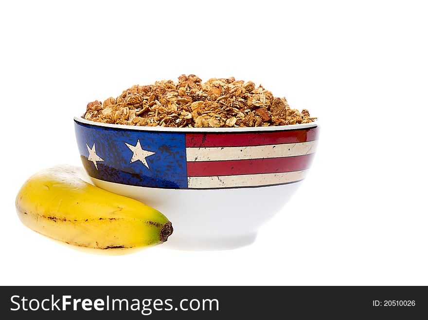 Bowl of Granola with an Banana Isolated Over White Background. Bowl of Granola with an Banana Isolated Over White Background