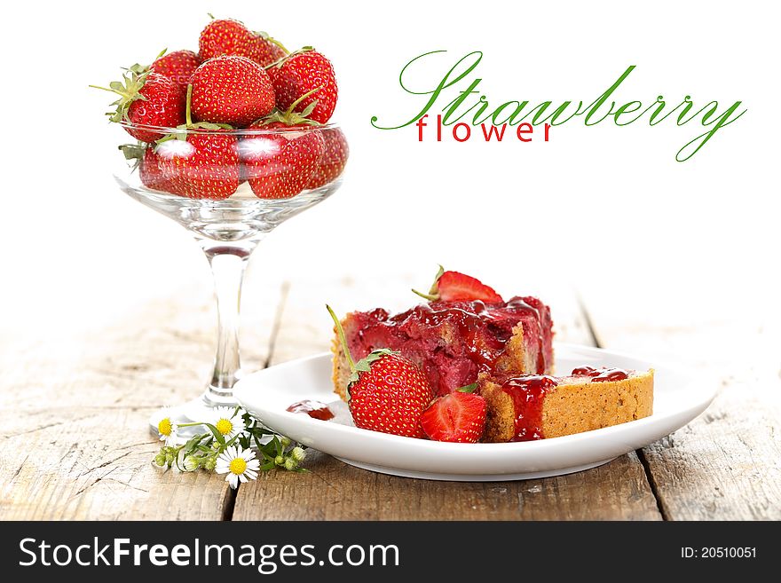 A cup of strawberries with a cake on the table with place for your text. A cup of strawberries with a cake on the table with place for your text