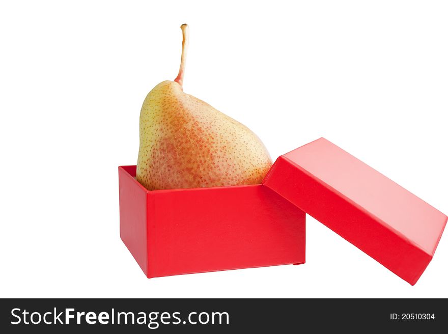 Ripe pear in a red gift box on white background