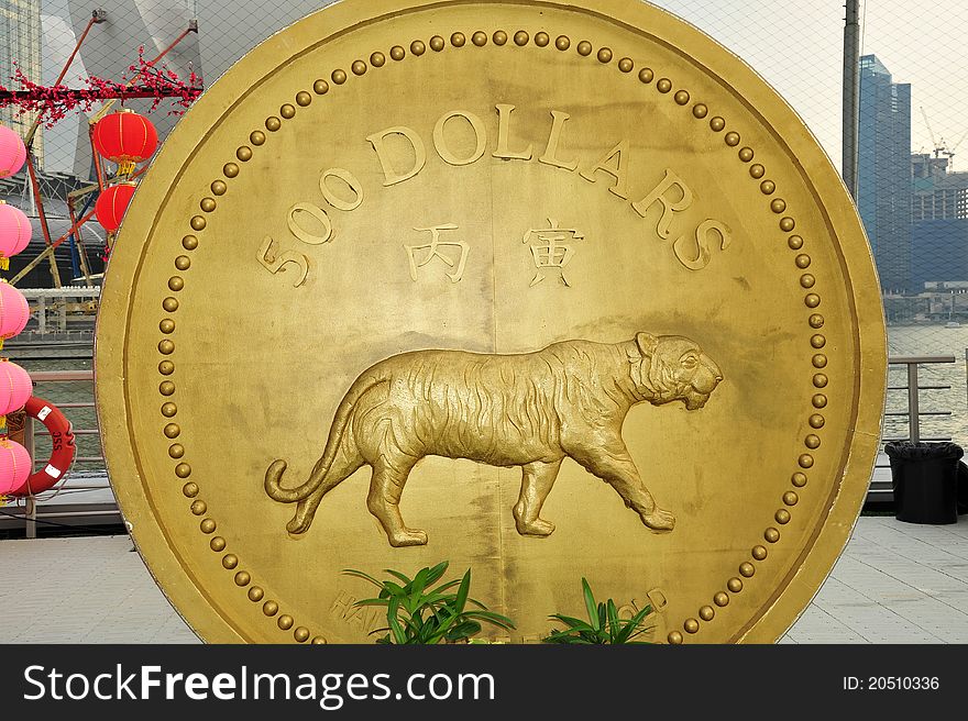 Gold coin of tiger on display
