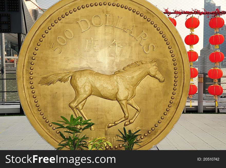 Gold coin of horse on display