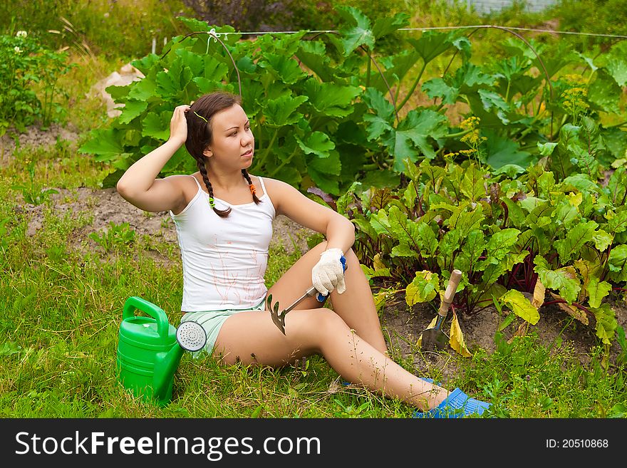 Young woman sitting on ground in muse. Young woman sitting on ground in muse