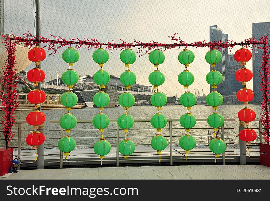 Green and red lanterns display in the city