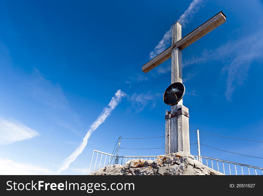 Summit cross on a blue sky of fog horn. Summit cross on a blue sky of fog horn