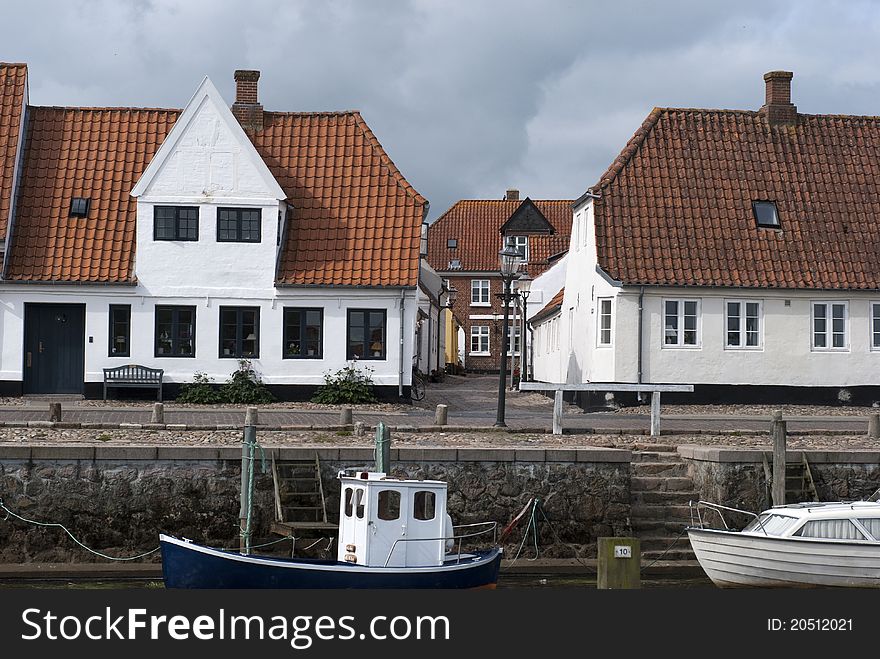 Nautical vessels and old vintage houses from Old Town Ribe in Denmark. Nautical vessels and old vintage houses from Old Town Ribe in Denmark.