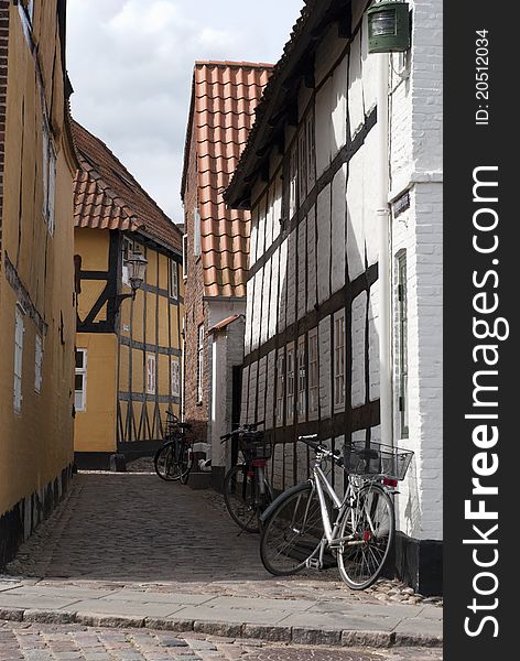 Narrow street with bicycles and buildings from Ribe in Denmark