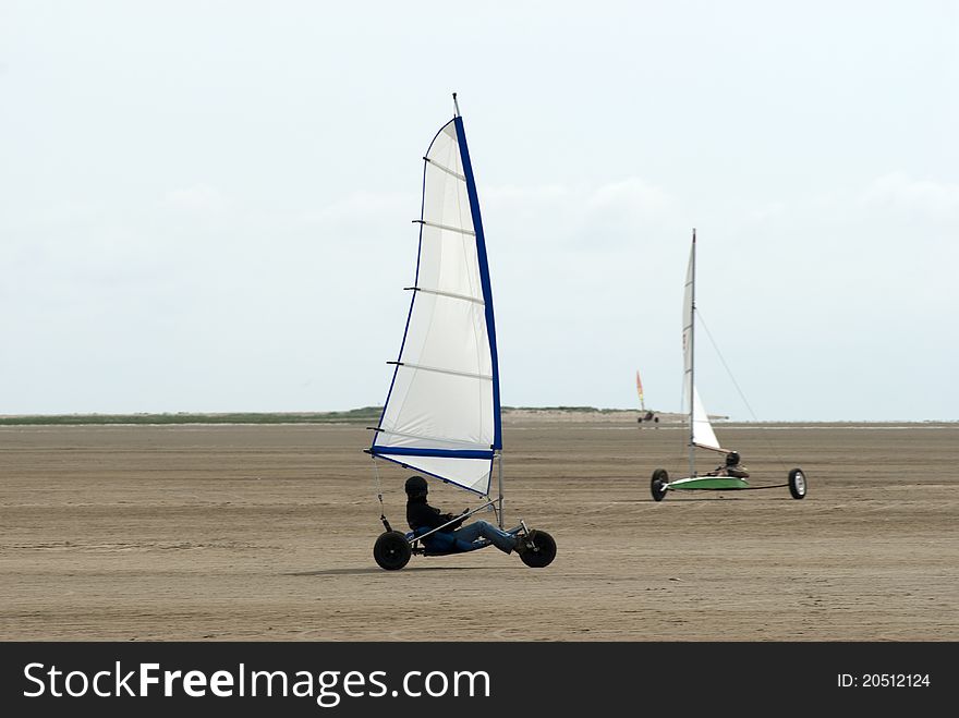 Land sailing on the beach a summer day on Roemoe in Denmark. Land sailing on the beach a summer day on Roemoe in Denmark