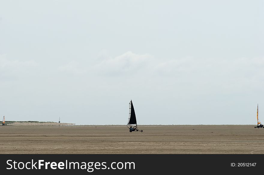 Black land sailer on big Roemoe beach close to The North Sea in Denmark