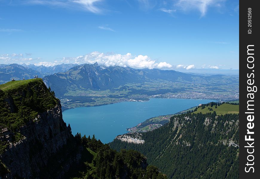 Blue lake with blue sky in green Switzerland