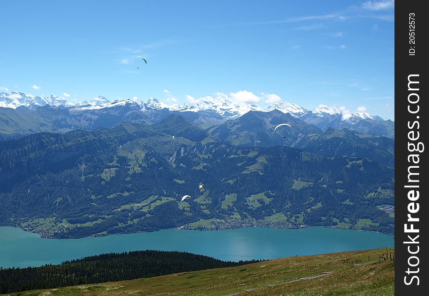 Blue lake with blue sky in green Switzerland