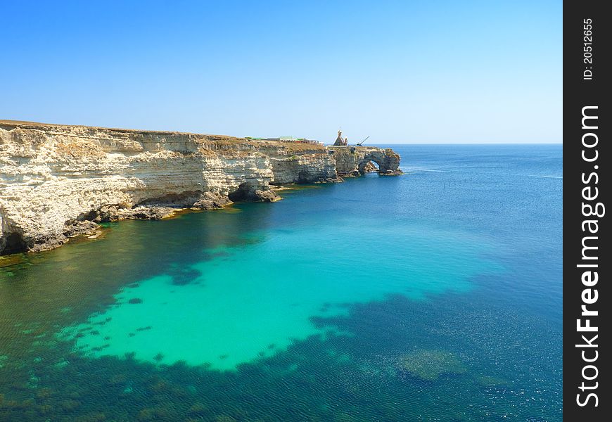 Church stands on the edge of a cliff into the sea leaving. landscape. Church stands on the edge of a cliff into the sea leaving. landscape