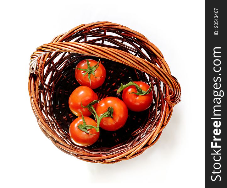 Tomatoes in the rattan basket. Top view