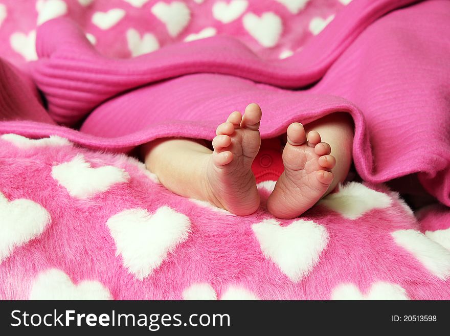 Small baby holding parents hand on blue background. Small baby holding parents hand on blue background