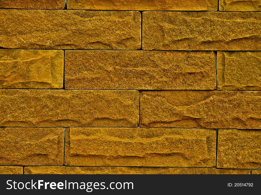 The yellow color brick wall texture