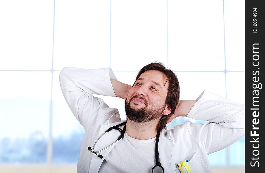 Closeup portrait of a happy senior doctor with stethoscope